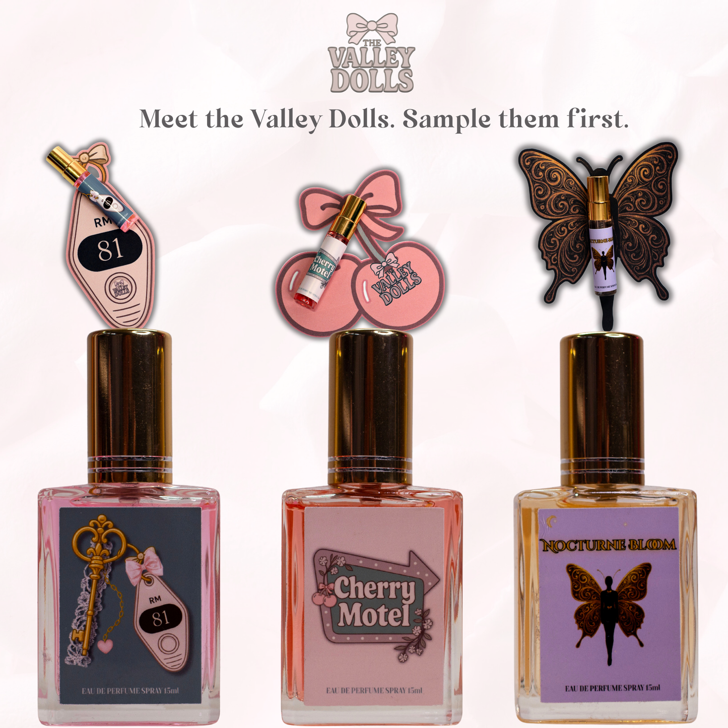 Valley Dolls perfume spray samples displayed with decorative themed backing cards, featuring Cherry Motel, Room 81, and Nocturne Bloom fragrances on a white background.