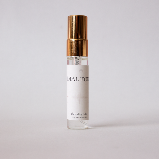 5mL luxury perfume spray sample labeled “Dial Tone” with gold cap on a white background