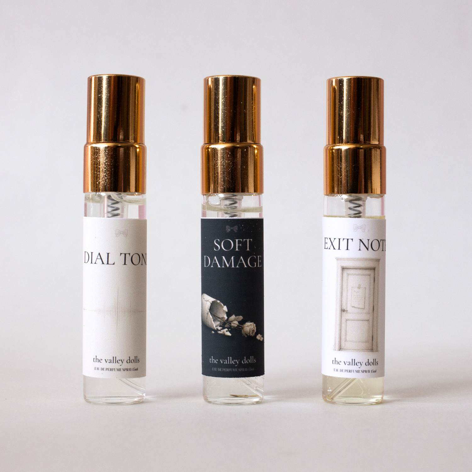 Three 5mL luxury perfume spray samples from The Valley Dolls Linger Collection on a white background