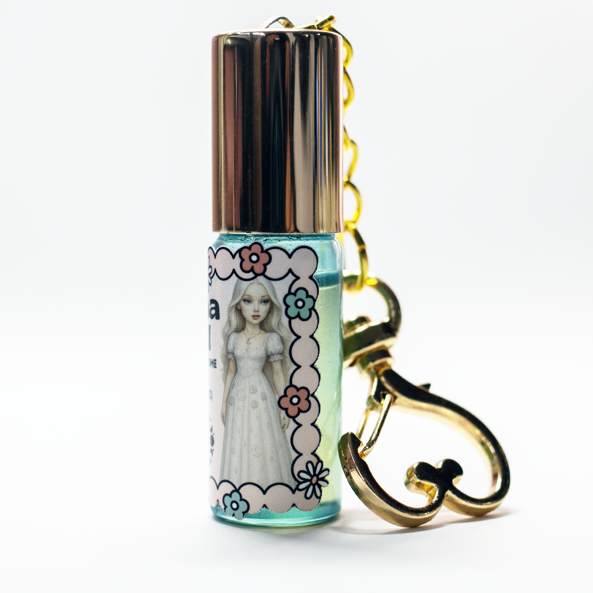 Luna Doll dreamy perfume oil roll-on in 5ml glass keychain bottle with gold heart clasp