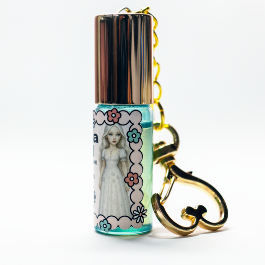 Luna Doll dreamy perfume oil roll-on in 5ml glass keychain bottle with gold heart clasp