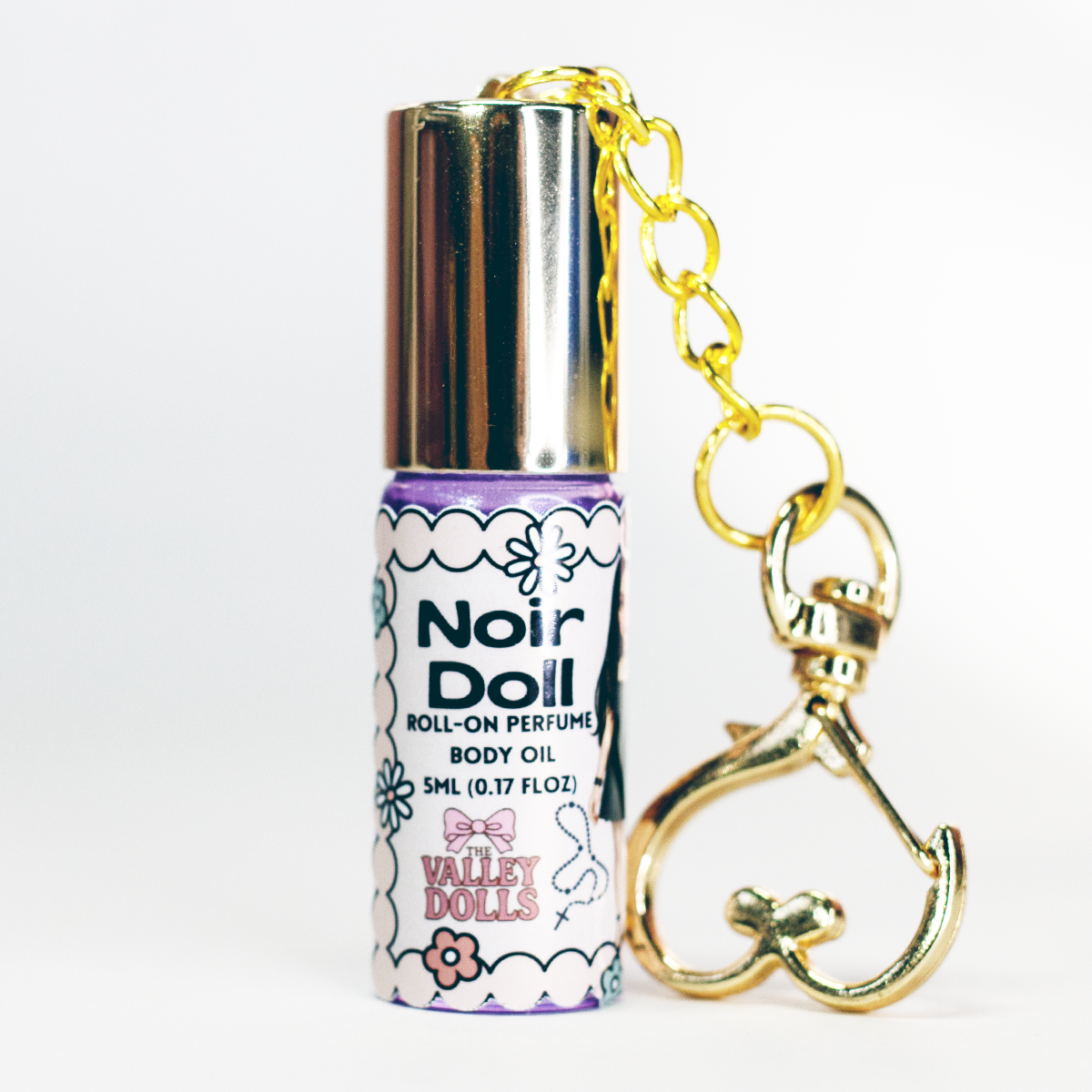 Noir Doll perfume oil roll-on, portable 5 ml fragrance bottle with gold heart keychain clasp – luxe magnetic scent by The Valley Dolls