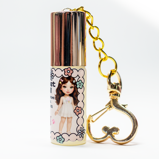 Sweet Doll perfume oil roll-on, gold heart keychain clasp detail on 5 ml glass bottle – The Valley Dolls fragrance collection