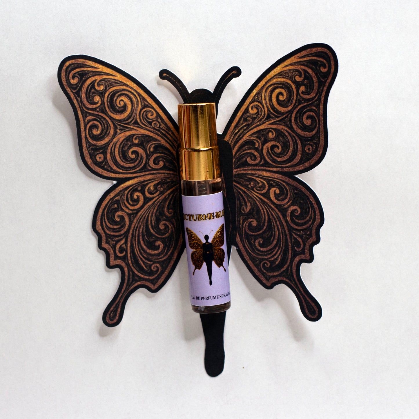Valley Dolls Nocturne Bloom 5 mL perfume spray sample presented on a butterfly-shaped decorative backing card