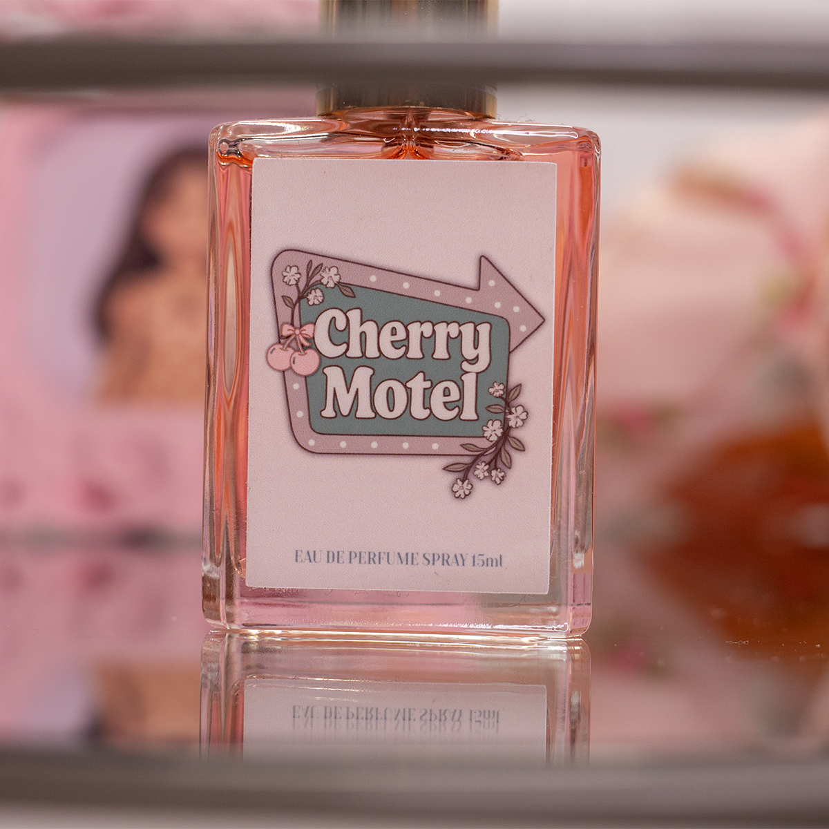 Cherry Motel Eau de Parfum spray with pink decor – feminine sweet perfume