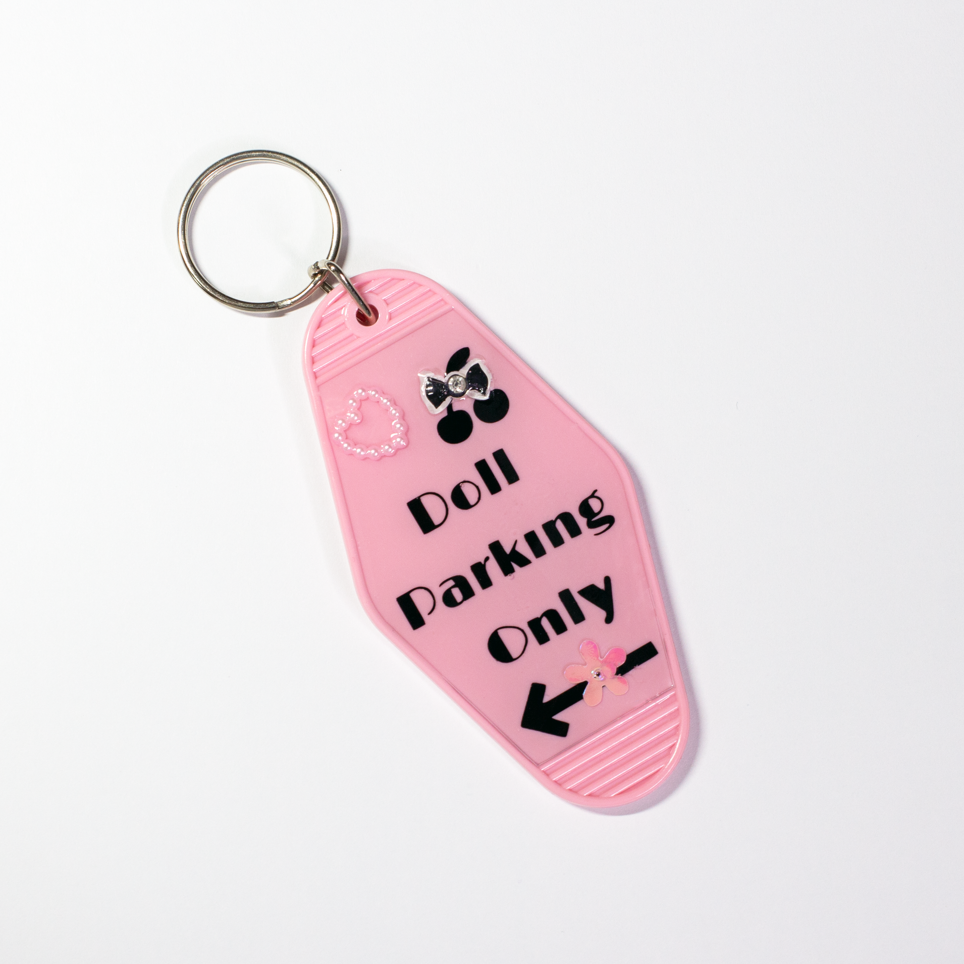 The Valley Dolls Lucky Doll pastel pink motel keychain with heart bow and gold clasp